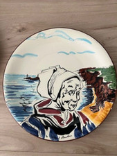 old handpainted plate representing woman traditional costum brittany quimper