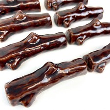 8 reposes couteaux porte-couteaux en céramique forme buche bois vintage 60s