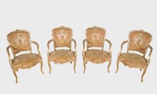 Quatre fauteuils dorés style Louis XV