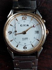 MONTRE CLYDA HOMME A QUARTZ DANS L ETAT AVEC ALARM ACIER PLAQUEE OR