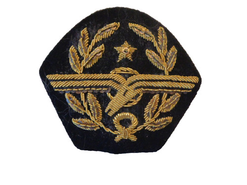 Insigne casquette à - de,