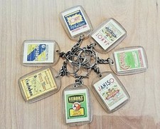 Porte clés années 60/70: LOT DE 7 JANOT / PUB DIVERSES AU DOS