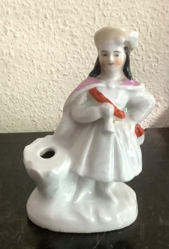 Statuette pique plume en - statuette,