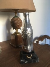 Bouteille Coca Cola en métal argenté poinçonné, trophée des années 50