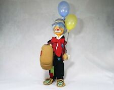 Clown en tissu sur armature en métal ballons en plastique 50 cm 