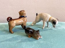 3 petits chiens en porcelaine