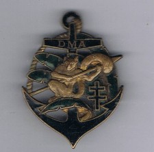 INSIGNE DETACHEMENT MOTORISE AUTONOME MADAGASCAR (VARIANTE TOUT DORE)