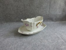 saucière sur dormant,motif floral, en porcelaine a.hache et cie,vierzon