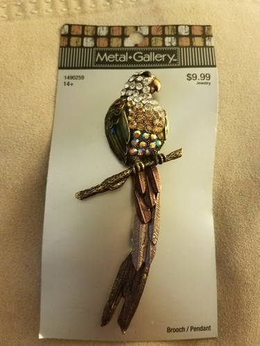 Parrot brooch and pendant with - and,