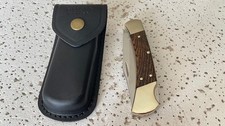110USA BUCK Ebony Wood Handle