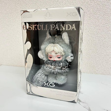 Pendentif poupée en peluche