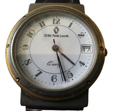 Montre en acier et doré à quartz marquée Renault Sens Poids Lourds. Pile neuve