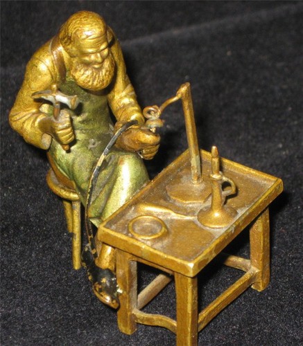 Bronze shoemaker work - , at
