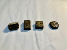 Ensemble de quatre poids monétaires. Moyen Orient, Inde. Bronze. 74g.