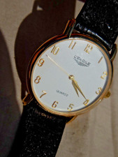 MONTRE QUARTZ L'EKOILE,FIN MODEL ULTRA PLAT PLAQUE OR(18K) COMME NEUVE