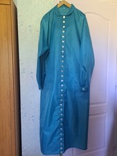 Blouse nylon semi épais, bleu turquoise à col chemisier  et ceinture à nouer