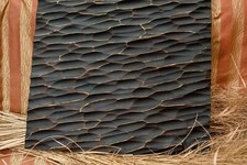 Plaque murale en bois sculpté