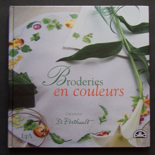 Livre broderies en couleurs - §,