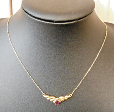 Collier ras de cou or 18K  sertie  rubis et diamant   poincon tete d aigle