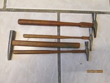 1 Lot de quatres marteaux d'horloger