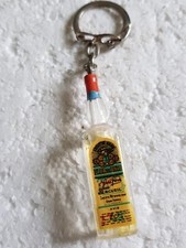 porte clé publicitaire (années 60/70) - Bouteille de FLOR D'ANIS a ARCEUIL