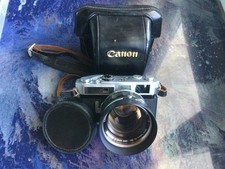 appareil photo canon7 +objectif 50 mm f/0,95 excellent état et fonctionnement.