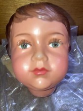 (d) tête de poupée CLAUDINET