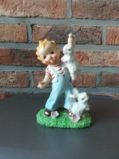 Figurine l'enfant aux lapins