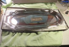 Jean Couzon  très grand plat de service en inox de 65 cm  , jamais utilisé.