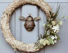 Frappe de porte abeille pour