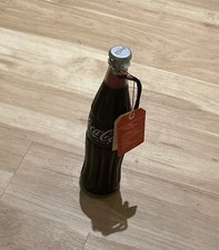 Coke red umbrella in bottle