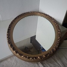 Miroir ovale ancien orné avec