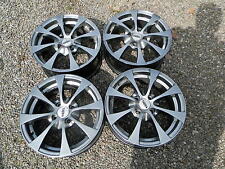 vends 4 jantes alu volkswagen 15' targa en 4x100 couleur titane etat neuf 