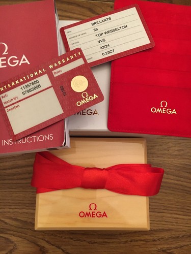 Omega box and warranty cards - box,