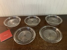 7 grands dessous de bouteille en cristal de Baccarat (prix à la pièce)