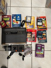 Console Atari 2600 façade bois CX-2600 S(sans boit)+ 7 jeux avec boite et notice