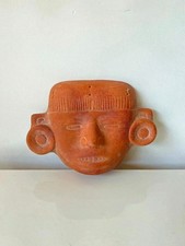 Masque mural en terre cuite