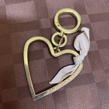 Sac Burberry's breloque coeur ruban doré logo articles de mode accessoires fe...