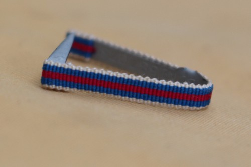 Fixe ruban rappel boutonnière