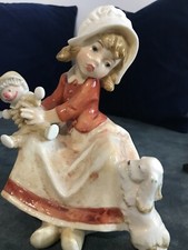 Ancienne statuette en céramique signé Amilcare Santini. Fille, chien & poupée