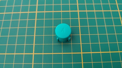 Bouton pièce manette - a,