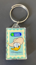 T1 - PORTE CLE Disneyland PARIS Nestlé DONALD Boussole intégrée OK ADVENTURELAND