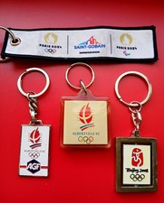 LOT DE 4 PORTE CLES PUBLICITAIRES THEME SPORT JEUX OLYMPIQUES METAL PVC TISSU