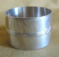 Rond de serviette Christofle modèle rubans croisés métal argenté