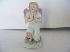 ancien ange à genoux en biscuit de porcelaine