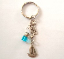 Porte Clé / Bijou de sac Voilier Hippocampe Cube bleu