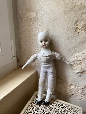 poupée tête porcelaine années 50 . Corps chiffon . Pas de vêtements . 