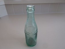 Straight side Coca Cola bottle