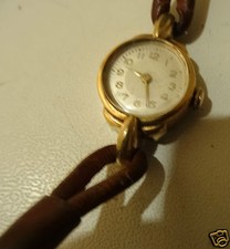 @ ANCIENNE MONTRE FEMME BOITIER PLAQUE OR AVEC POINCON ORFEVRE " RIB "