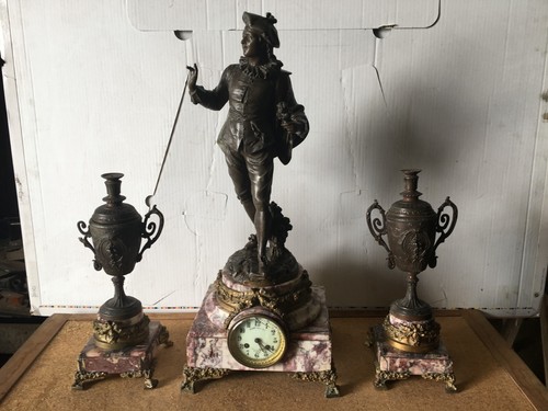 Pendule flambeaux avec - et,